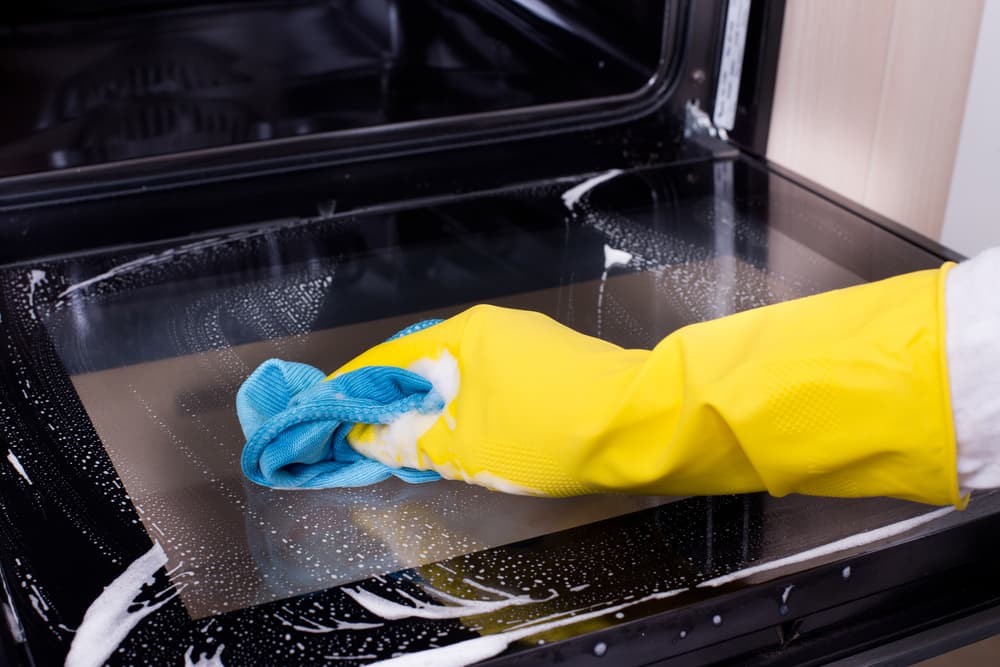 What is the best way to clean the inside of an oven